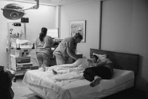 Chicago birth photography - midwife and labor & delivery nurse caring for new family
